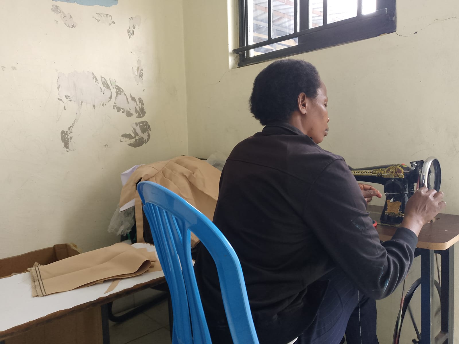 Tailoring project - woman learning to sew clothes